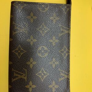 LV's small wristlet is cute to pick up and head to the store.